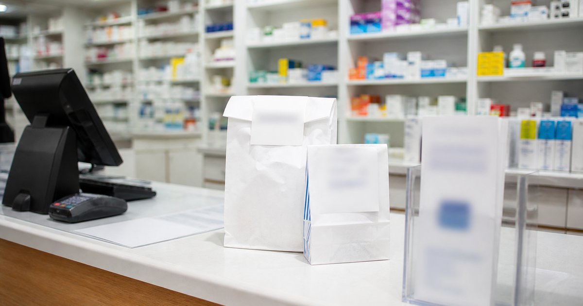 A pharmacy counter with prescription bags